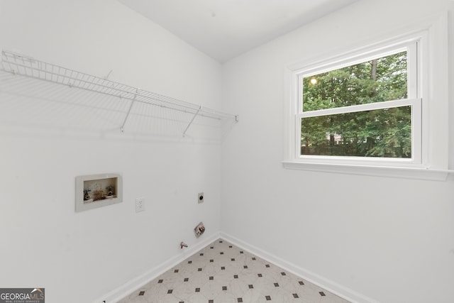 10865 Misty Moon Ct, Alpharetta, GA 30022 - laundry area with washer hookup, electric dryer hookup, baseboards, gas dryer hookup, and light flooring