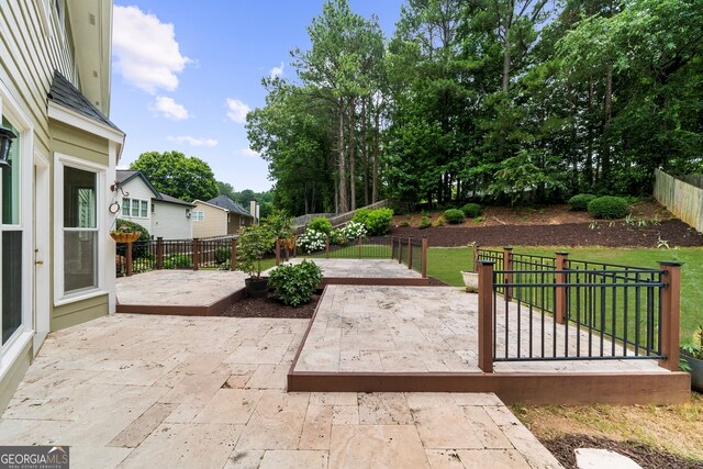10865 Misty Moon Ct, Alpharetta, GA 30022 - fenced backyard featuring a patio area