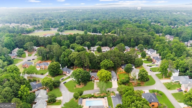 10865 Misty Moon Ct, Alpharetta, GA 30022 - aerial perspective of suburban area with a heavily wooded area