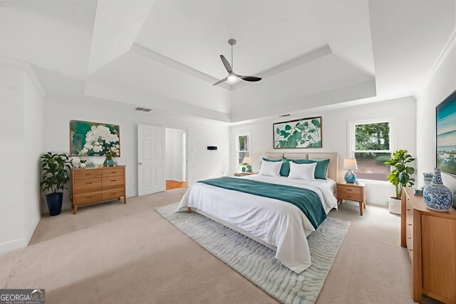10865 Misty Moon Ct, Alpharetta, GA 30022 - bedroom with a raised ceiling, light carpet, and a ceiling fan