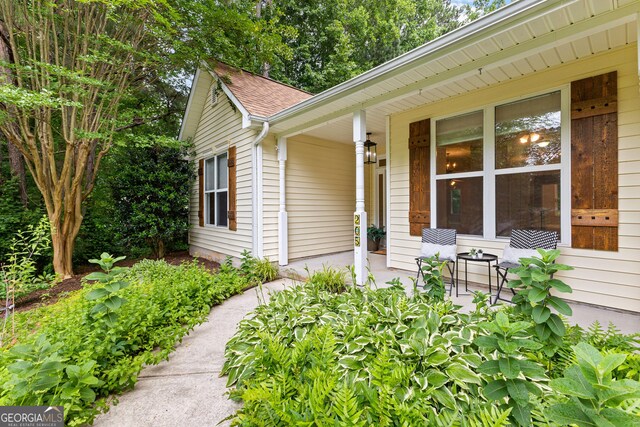 205 N Strathmore Dr, Sharpsburg, GA 30277 - entrance to property featuring covered porch and roof with shingles