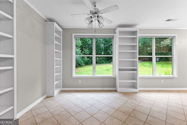 205 N Strathmore Dr, Sharpsburg, GA 30277 - spare room with tile patterned flooring, plenty of natural light, built in features, and crown molding