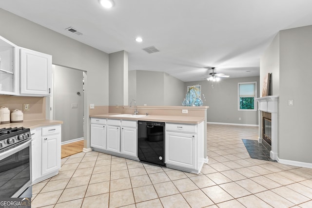 205 N Strathmore Dr, Sharpsburg, GA 30277 - kitchen featuring black dishwasher, stainless steel gas range oven, a sink, light tile patterned floors, and light countertops