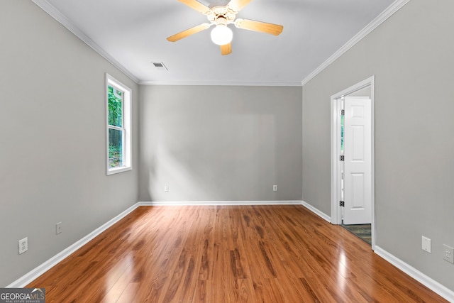 205 N Strathmore Dr, Sharpsburg, GA 30277 - empty room featuring wood finished floors, baseboards, a ceiling fan, and ornamental molding