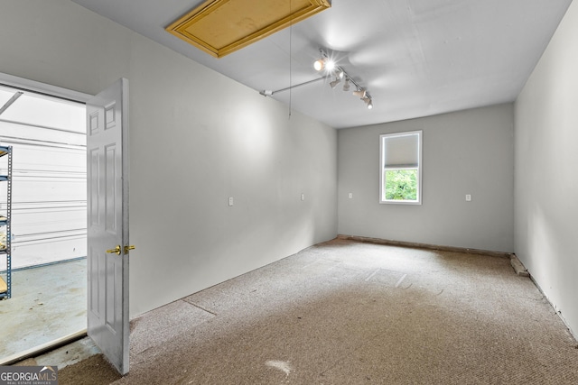 205 N Strathmore Dr, Sharpsburg, GA 30277 - empty room featuring attic access and carpet floors