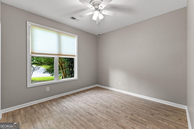 205 N Strathmore Dr, Sharpsburg, GA 30277 - empty room with baseboards, wood finished floors, and a ceiling fan