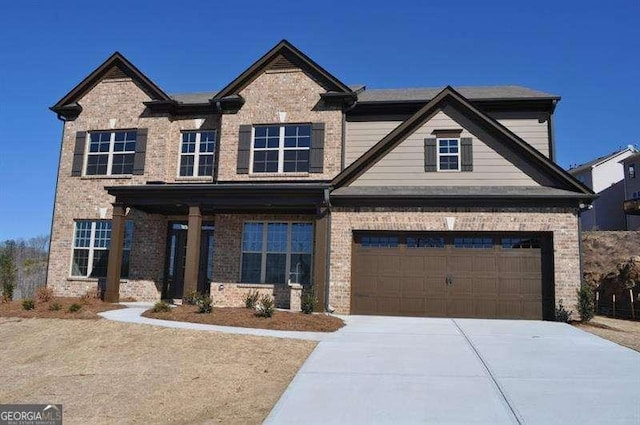 920 Crescent Ridge Dr, Buford, GA 30518 - craftsman-style home with brick siding, concrete driveway, and a garage