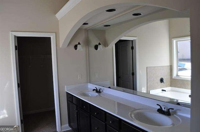 920 Crescent Ridge Dr, Buford, GA 30518 - bathroom with double vanity, a bath, and a walk in closet