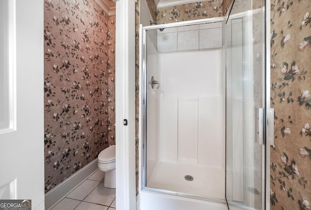 65 Orchard Dr, Covington, GA 30014 - full bath featuring wallpapered walls, tile patterned flooring, toilet, a stall shower, and baseboards