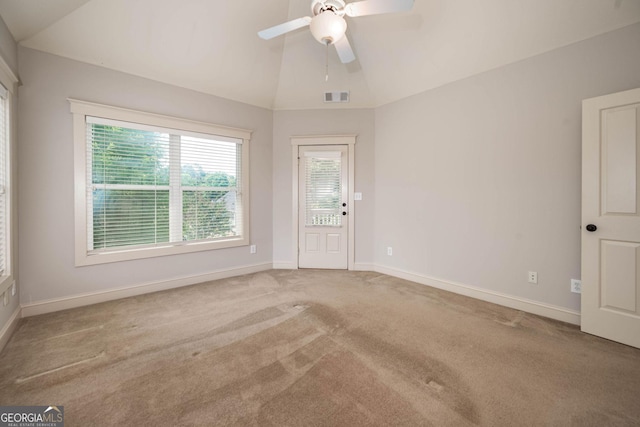 65 Orchard Dr, Covington, GA 30014 - empty room with carpet, lofted ceiling, a ceiling fan, and baseboards