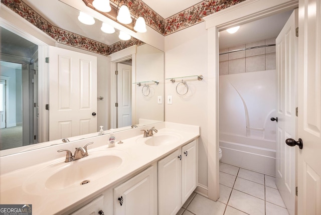 65 Orchard Dr, Covington, GA 30014 - full bath with double vanity, toilet, tile patterned flooring, and shower / bath combination