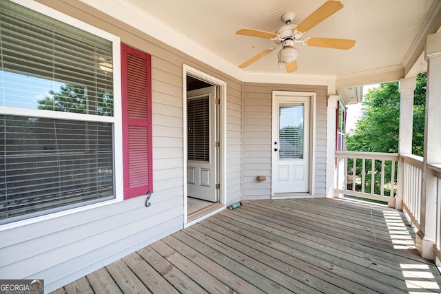 65 Orchard Dr, Covington, GA 30014 - wooden porch with a ceiling fan