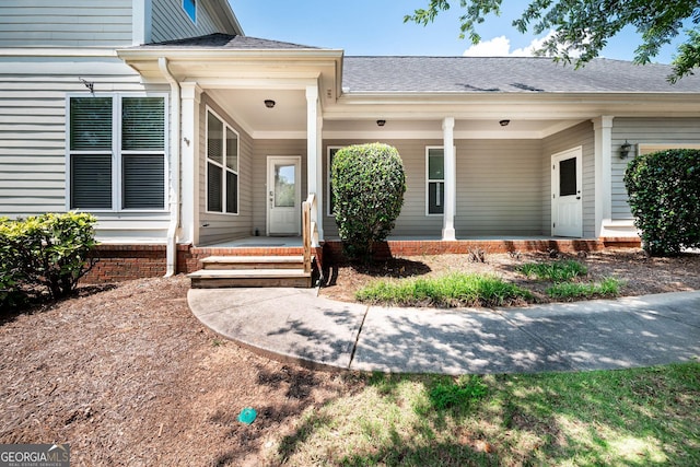65 Orchard Dr, Covington, GA 30014 - property entrance featuring a porch and a shingled roof