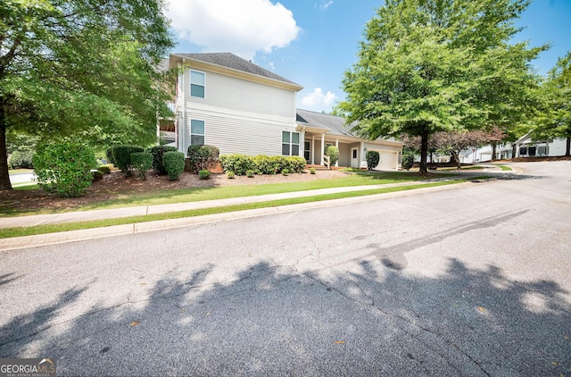 65 Orchard Dr, Covington, GA 30014 - traditional home with a garage and driveway
