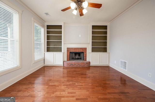 65 Orchard Dr, Covington, GA 30014 - unfurnished living room with built in features, ceiling fan, baseboards, and a fireplace