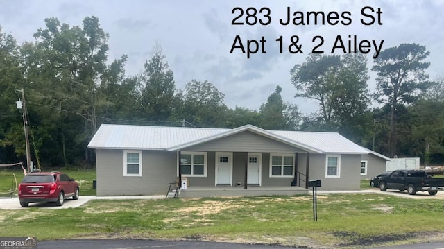 000375 Brooks Kirkland Rd, Vidalia, GA 30474 - ranch-style house with a porch, metal roof, and a front yard