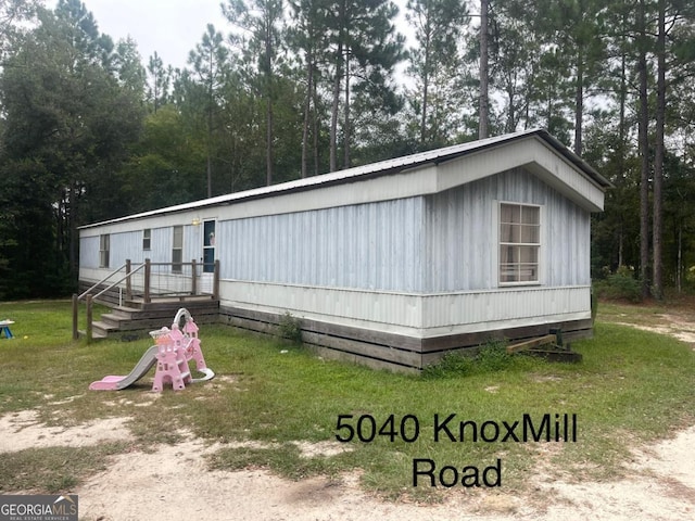 000375 Brooks Kirkland Rd, Vidalia, GA 30474 - view of front facade with metal roof and a front yard