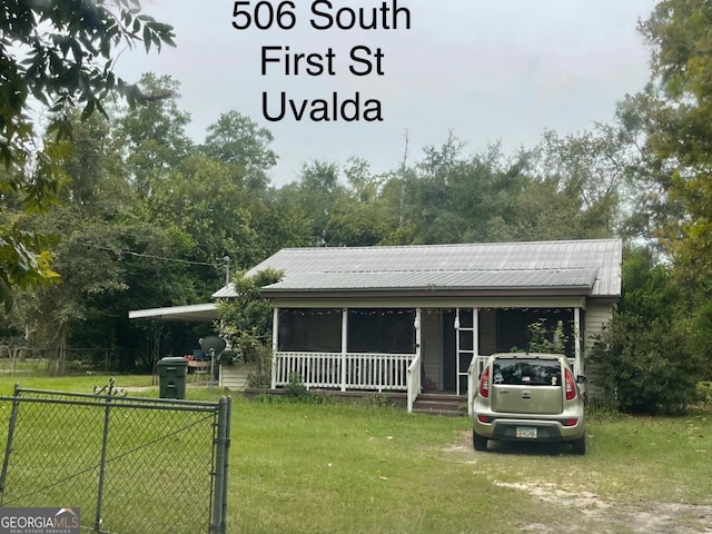 000375 Brooks Kirkland Rd, Vidalia, GA 30474 - view of front of home featuring covered porch, an attached carport, and metal roof