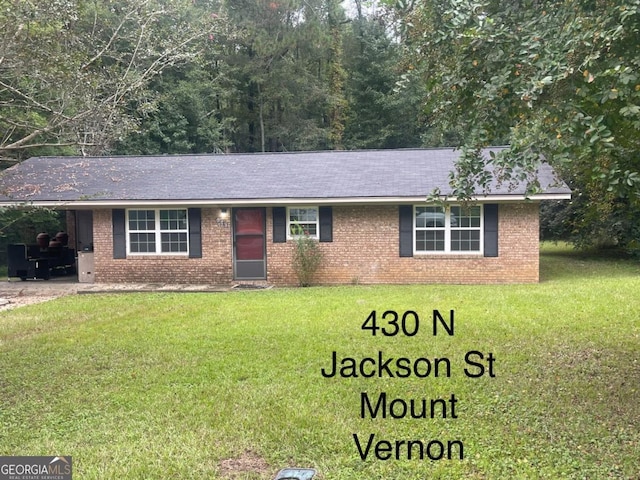 000375 Brooks Kirkland Rd, Vidalia, GA 30474 - single story home featuring a front yard, brick siding, an attached carport, and a shingled roof