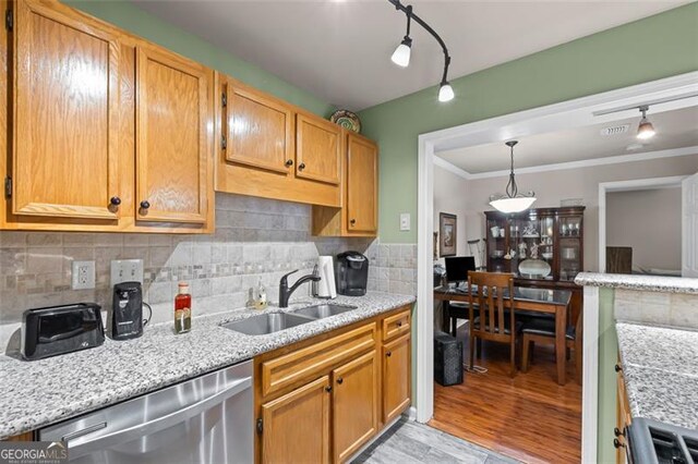 202 Berkeley Woods Dr, Duluth, GA 30096 - kitchen with a sink, stainless steel dishwasher, backsplash, light stone counters, and crown molding
