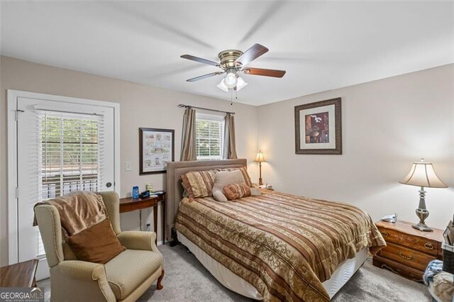 202 Berkeley Woods Dr, Duluth, GA 30096 - carpeted bedroom featuring access to outside and a ceiling fan