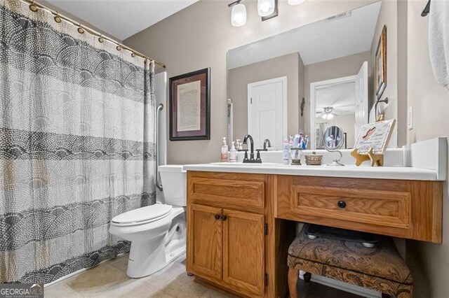 202 Berkeley Woods Dr, Duluth, GA 30096 - bathroom featuring vanity, toilet, tile patterned floors, ceiling fan, and curtained shower