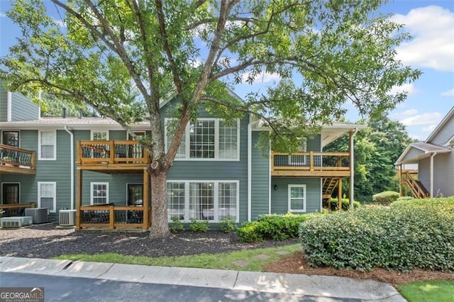 202 Berkeley Woods Dr, Duluth, GA 30096 - back of house with central AC and a wooden deck