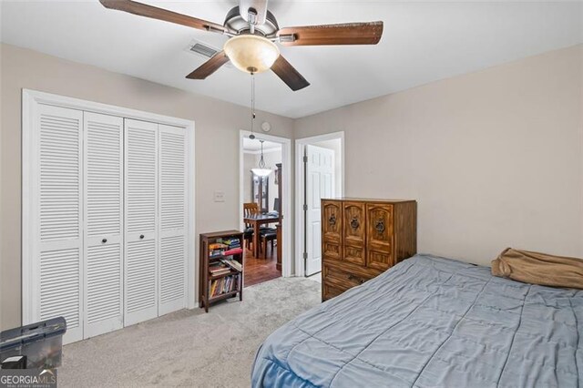 202 Berkeley Woods Dr, Duluth, GA 30096 - carpeted bedroom with a closet and ceiling fan