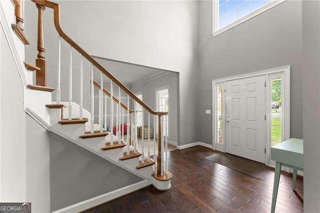 2342 Tall Timbers Ln, Marietta, GA 30066 - entrance foyer with a towering ceiling, stairway, hardwood / wood-style floors, and baseboards