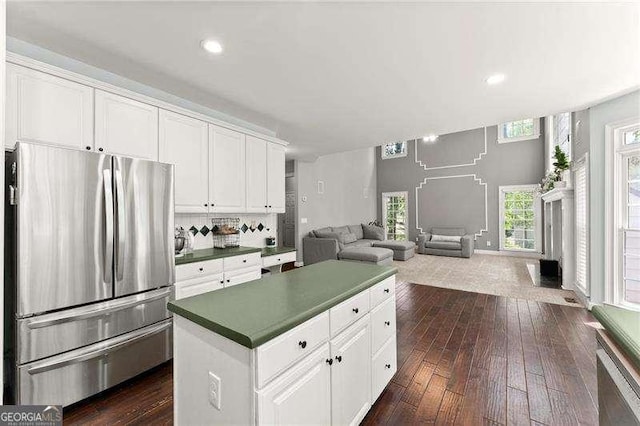 2342 Tall Timbers Ln, Marietta, GA 30066 - kitchen featuring freestanding refrigerator, open floor plan, a center island, dark wood-style flooring, and white cabinetry