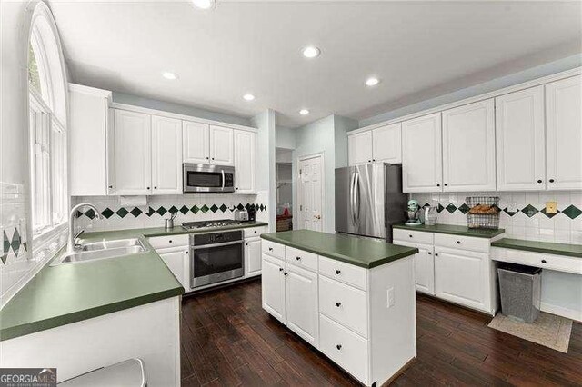 2342 Tall Timbers Ln, Marietta, GA 30066 - kitchen featuring appliances with stainless steel finishes, a sink, backsplash, dark countertops, and recessed lighting