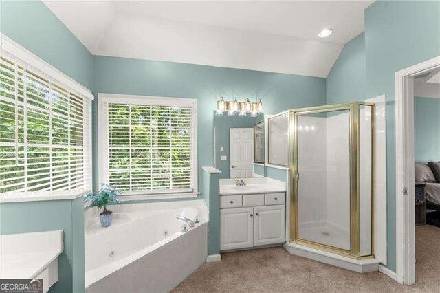 2342 Tall Timbers Ln, Marietta, GA 30066 - full bath with plenty of natural light, a shower stall, a tub with jets, and vaulted ceiling