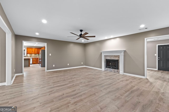 810 Callaway Church Rd, Lagrange, GA 30241 - unfurnished living room featuring a ceiling fan, recessed lighting, light wood-style flooring, and a glass covered fireplace