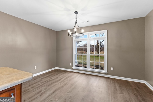 810 Callaway Church Rd, Lagrange, GA 30241 - unfurnished dining area featuring a chandelier and wood finished floors