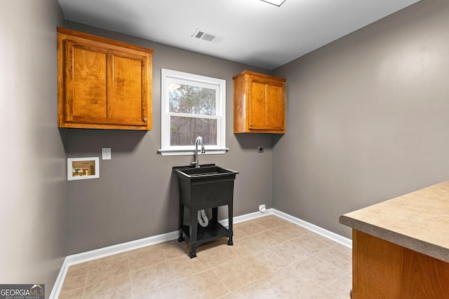 810 Callaway Church Rd, Lagrange, GA 30241 - washroom with cabinet space, electric dryer hookup, hookup for a washing machine, and light tile patterned floors