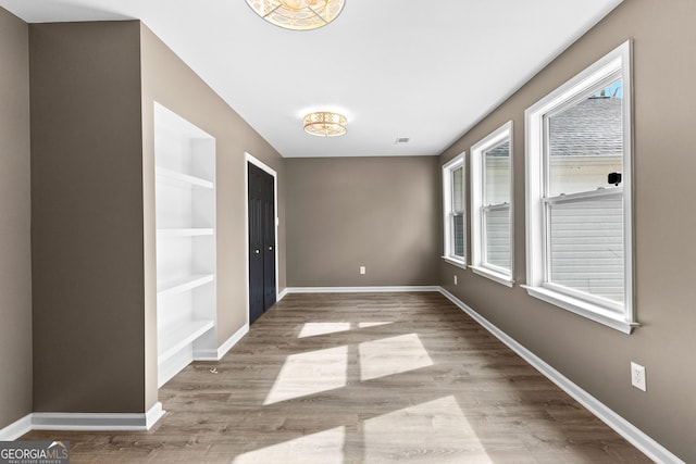 810 Callaway Church Rd, Lagrange, GA 30241 - unfurnished room with built in shelves and wood finished floors