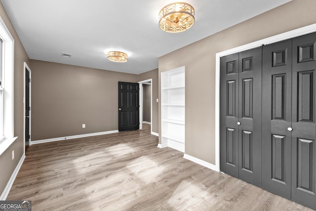 810 Callaway Church Rd, Lagrange, GA 30241 - unfurnished bedroom with wood finished floors and a chandelier