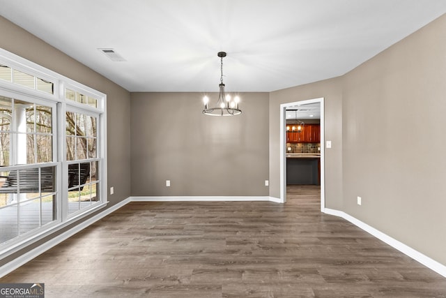810 Callaway Church Rd, Lagrange, GA 30241 - unfurnished dining area featuring a chandelier and dark wood-style floors