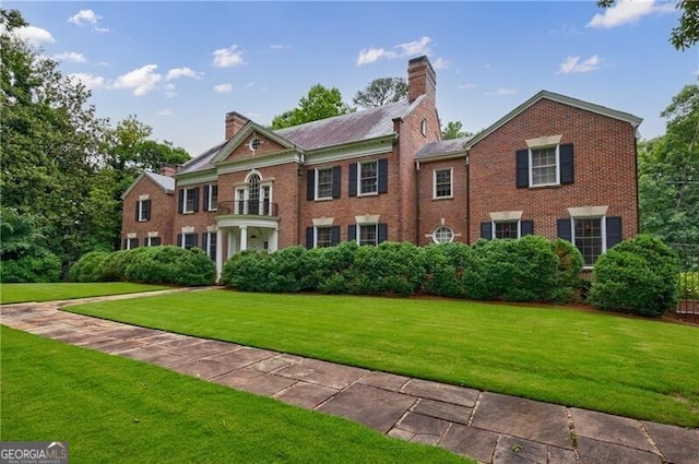 280 Blackland Rd NW, Atlanta, GA 30342 - view of front of property with a chimney, brick siding, and a front yard