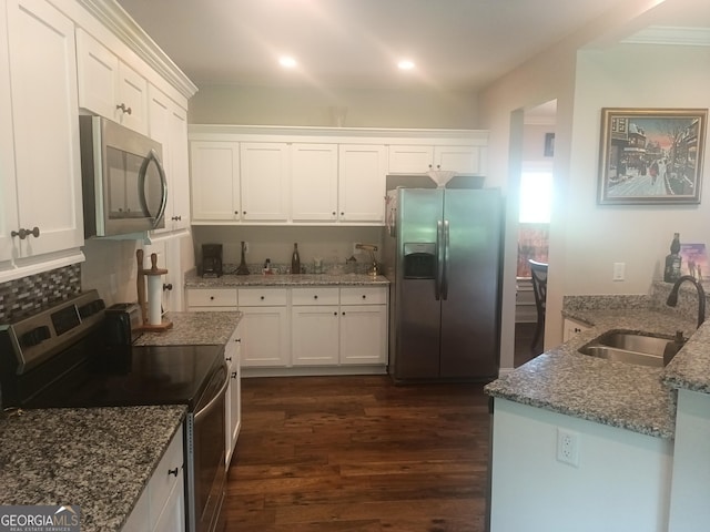 130 Burnt Hickory Ln, Calhoun, GA 30701 - kitchen featuring appliances with stainless steel finishes, a sink, dark wood finished floors, white cabinets, and recessed lighting