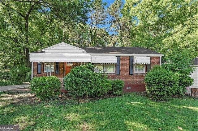 2576 Godfrey Dr, Atlanta, GA 30318 - view of front facade featuring brick siding, a front lawn, and crawl space