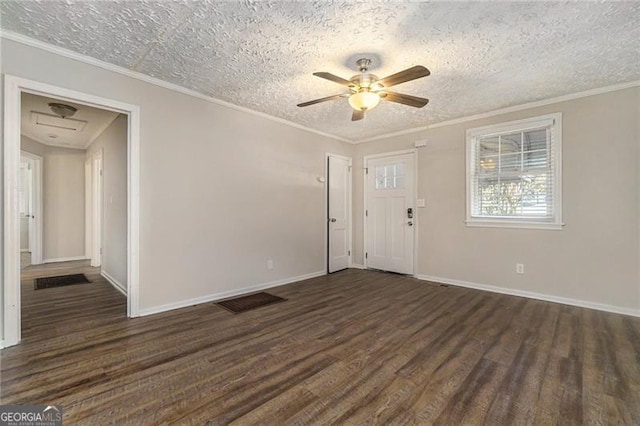 2576 Godfrey Dr, Atlanta, GA 30318 - empty room featuring dark wood-type flooring, a ceiling fan, baseboards, a textured ceiling, and crown molding