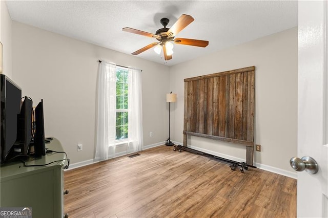 437 Jewell Slaton Rd, Dawsonville, GA 30534 - unfurnished office with wood finished floors, a ceiling fan, and baseboards