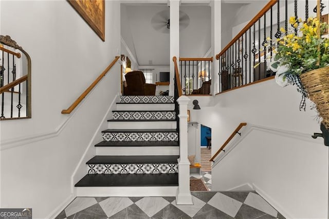 437 Jewell Slaton Rd, Dawsonville, GA 30534 - stairs featuring ceiling fan, a towering ceiling, and tile patterned floors