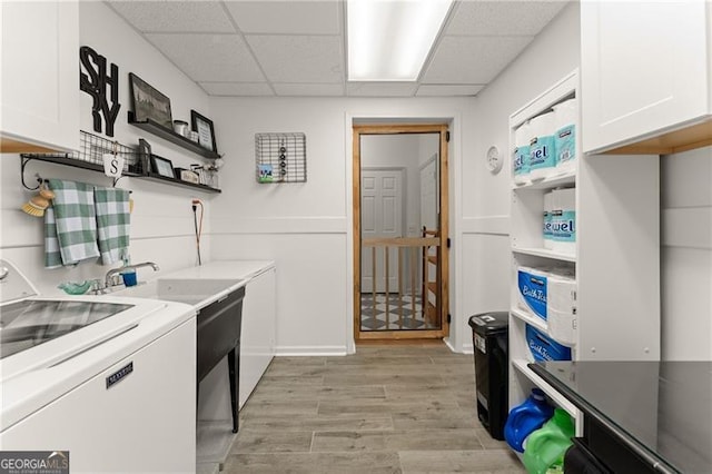 437 Jewell Slaton Rd, Dawsonville, GA 30534 - laundry room with washer / dryer, cabinet space, and light wood-type flooring