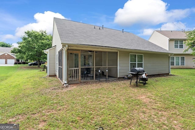 11581 Kades Trl, Hampton, GA 30228 - rear view of house with a lawn, a sunroom, a patio area, and a shingled roof