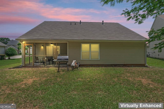 11581 Kades Trl, Hampton, GA 30228 - back of property with a yard, a patio area, a shingled roof, and a ceiling fan