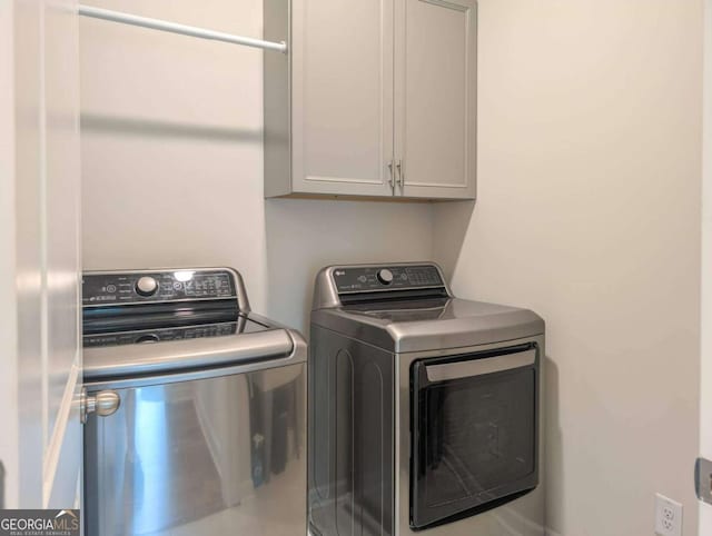 7345 Vale Ct, Cumming, GA 30028 - laundry area with washing machine and dryer and cabinet space