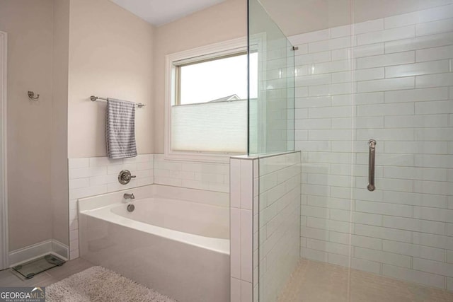 7345 Vale Ct, Cumming, GA 30028 - bathroom with a bath and a shower stall