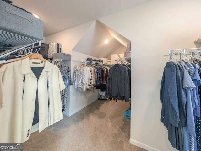 7345 Vale Ct, Cumming, GA 30028 - walk in closet with carpet floors and vaulted ceiling